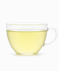 Taza de cristal con infusión de té verde Dragon Well